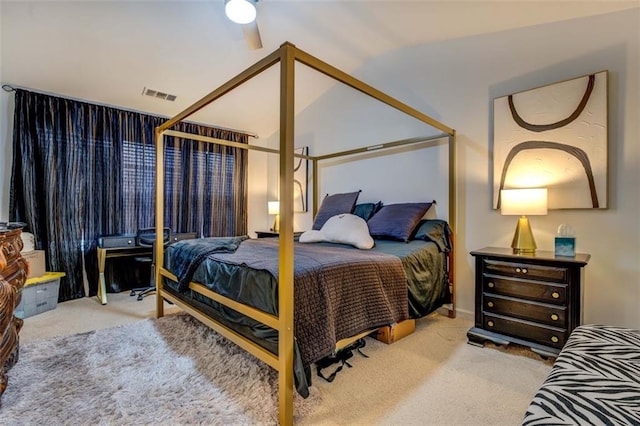 bedroom with vaulted ceiling, carpet flooring, and ceiling fan