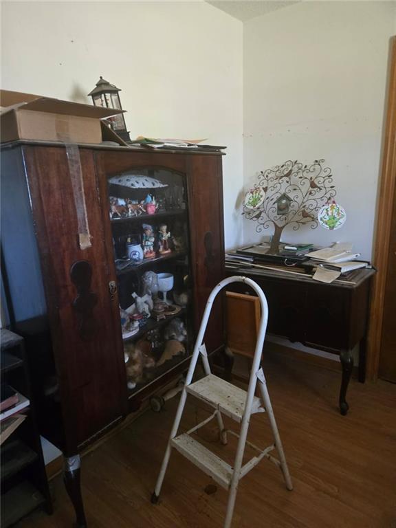 home office with wood finished floors