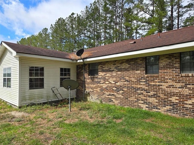 back of house with brick siding