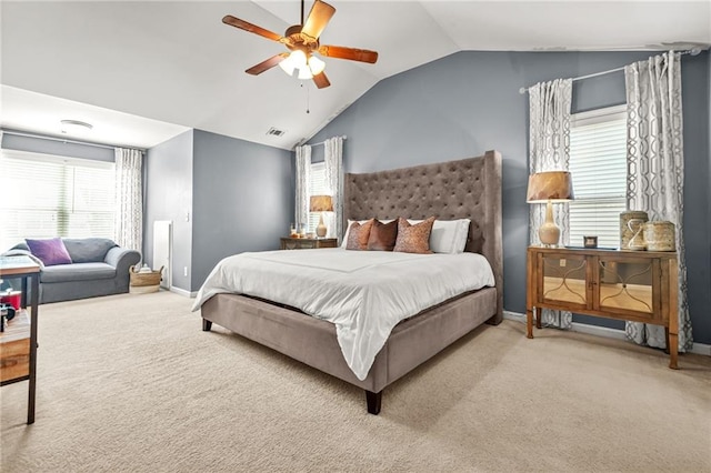 bedroom with carpet floors, vaulted ceiling, baseboards, and ceiling fan