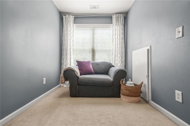 sitting room with carpet floors and baseboards