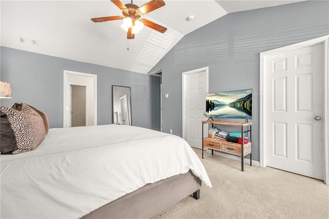 carpeted bedroom featuring lofted ceiling and ceiling fan