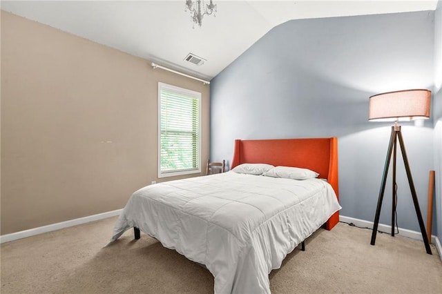 carpeted bedroom with lofted ceiling and baseboards