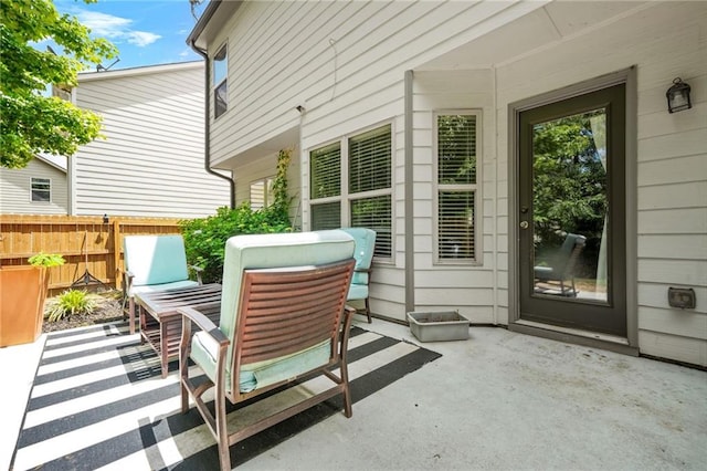 view of patio / terrace featuring fence and outdoor dining area