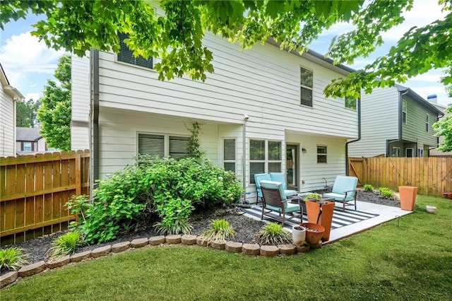 back of property with a patio