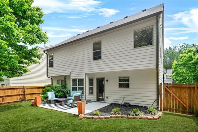 back of property with a patio and a gate
