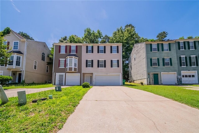 6509 Charter Way, Lithonia, GA 30058 - townhome / multi-family property with a front lawn, concrete driveway, and a garage