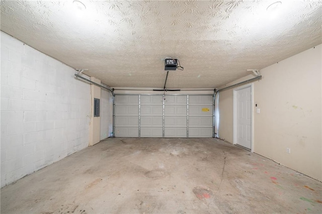 6509 Charter Way, Lithonia, GA 30058 - garage with a garage door opener and concrete block wall