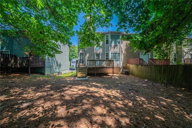 6509 Charter Way, Lithonia, GA 30058 - back of house featuring a deck, stairway, and a chimney