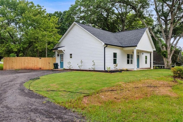 12 New St, Newnan, GA 30263 - view of side of property with roof with shingles and a gate