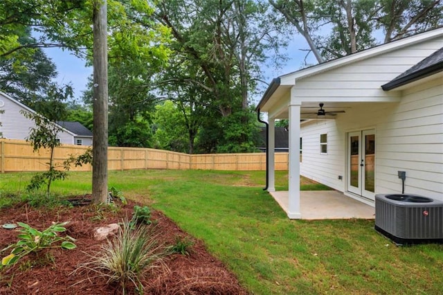12 New St, Newnan, GA 30263 - view of yard featuring french doors, cooling unit, ceiling fan, and a patio