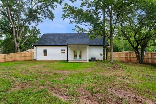 12 New St, Newnan, GA 30263 - back of property featuring french doors, roof with shingles, and cooling unit