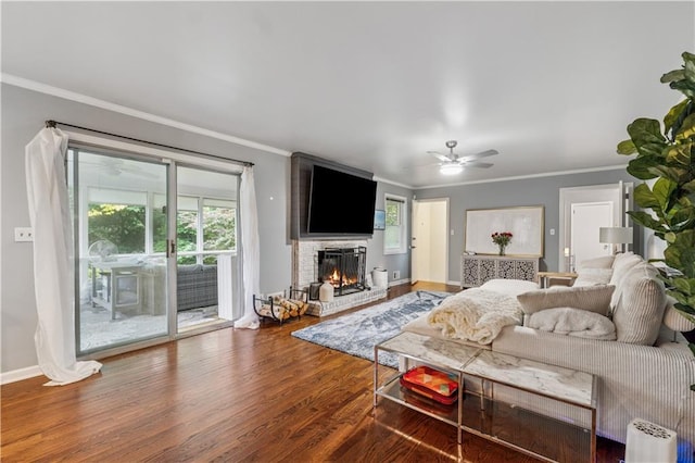 2900 Townley Cir, Atlanta, GA 30340 - living room featuring wood finished floors, a ceiling fan, a fireplace, ornamental molding, and baseboards