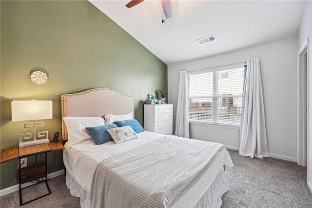 carpeted bedroom featuring lofted ceiling and ceiling fan