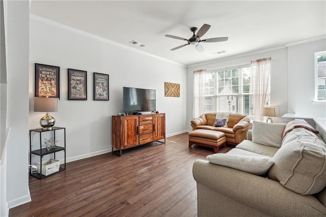 living room with ceiling fan, crown molding, and dark wood-type flooring