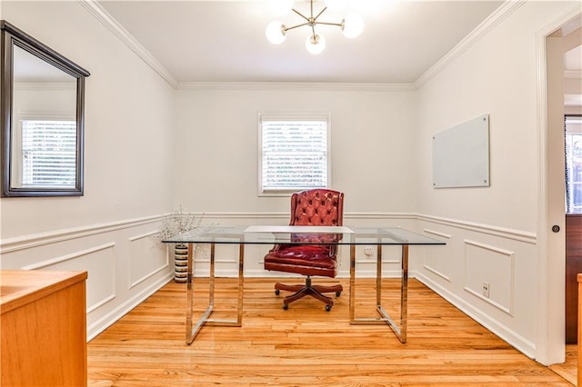 home office with crown molding, plenty of natural light, and light hardwood / wood-style floors