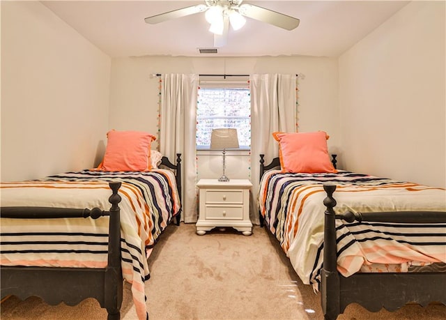 bedroom with light carpet and ceiling fan