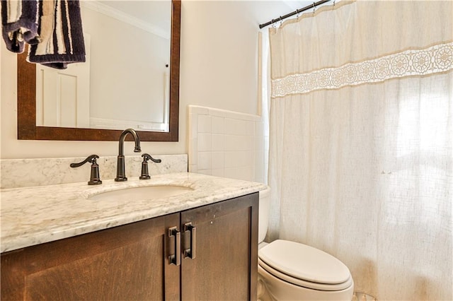 bathroom featuring vanity, crown molding, curtained shower, and toilet