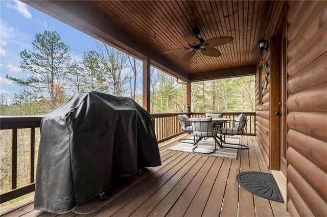 deck with ceiling fan and a grill