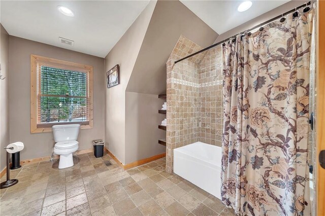 bathroom with toilet and shower / bath combo