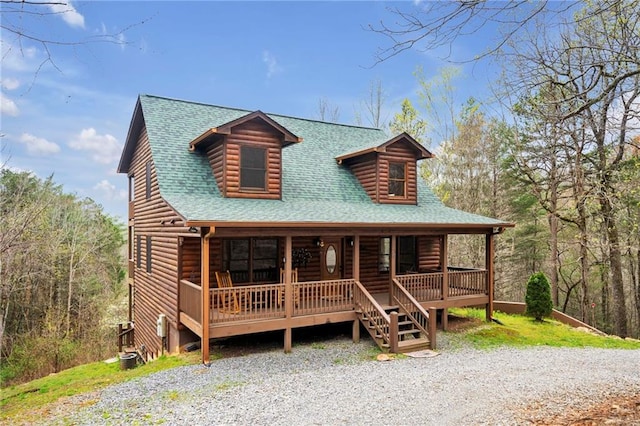 log-style house with a porch