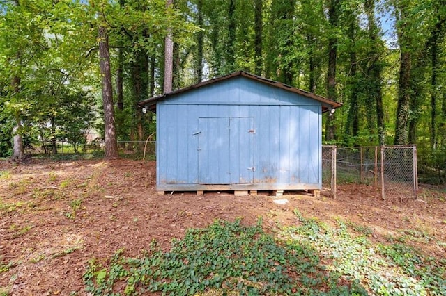 view of shed with fence