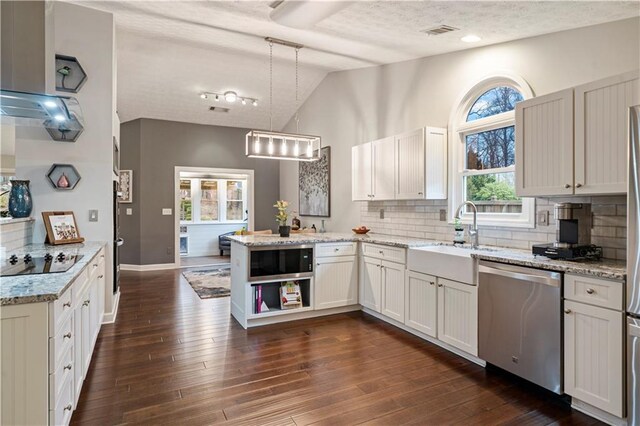 kitchen with black electric cooktop, a peninsula, dark wood-style flooring, a sink, and dishwasher