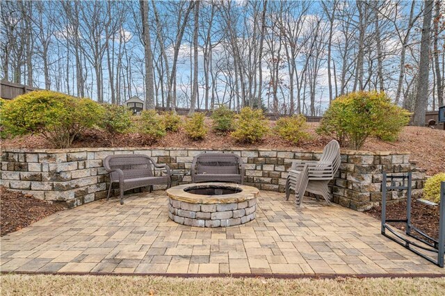 view of patio / terrace with an outdoor fire pit