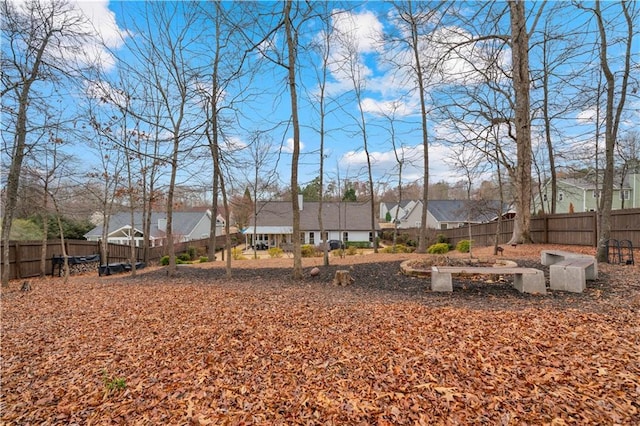 view of yard featuring a residential view and fence