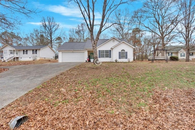 ranch-style home with a front yard and a garage