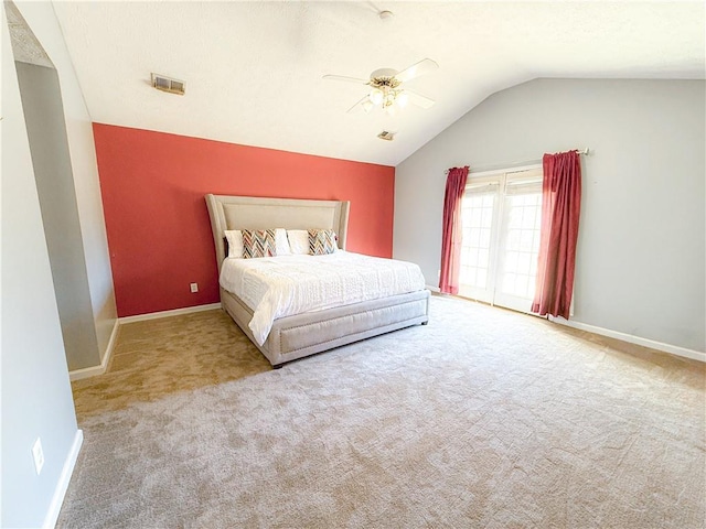 bedroom featuring vaulted ceiling, light colored carpet, and ceiling fan