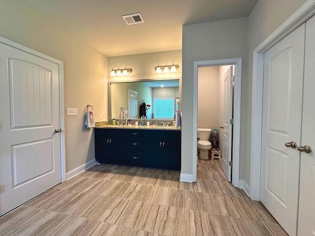360 Walker Rd, Byron, GA 31008 - full bathroom featuring double vanity and toilet