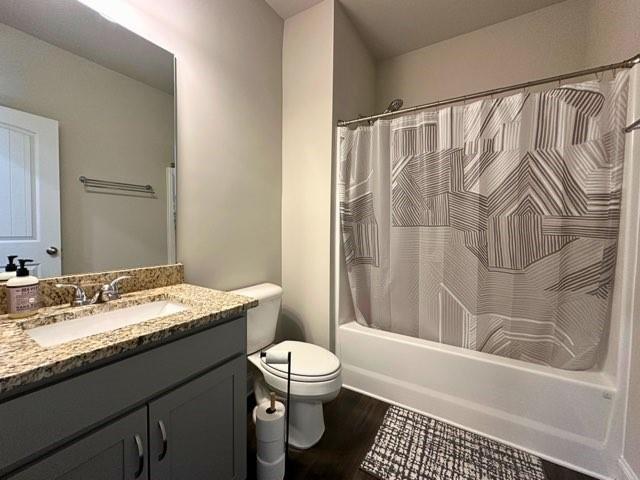 360 Walker Rd, Byron, GA 31008 - full bathroom featuring vanity, wood finished floors, and shower / bath combo