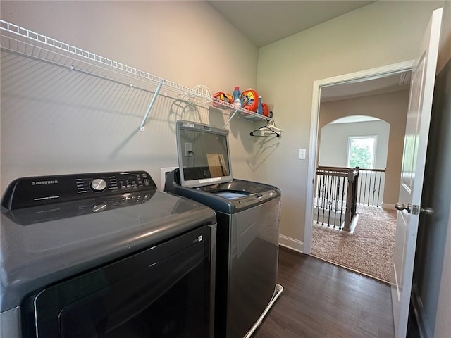 360 Walker Rd, Byron, GA 31008 - washroom featuring washer and dryer, arched walkways, and dark wood finished floors