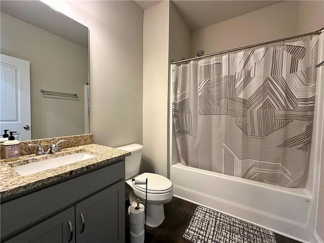 360 Walker Rd, Byron, GA 31008 - full bath with vanity, wood finished floors, and shower / bath combo