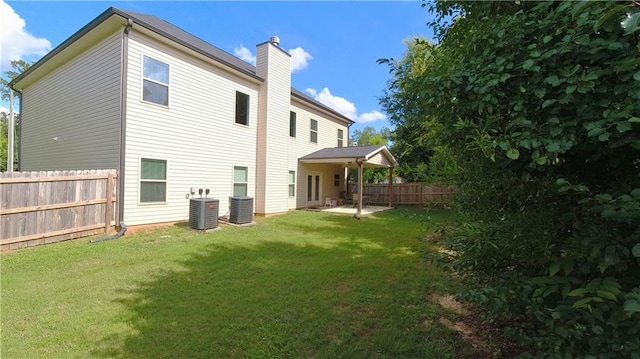 360 Walker Rd, Byron, GA 31008 - rear view of house with a chimney and a patio area
