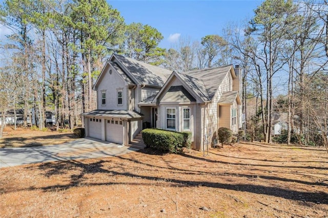 view of front facade featuring driveway and an attached garage