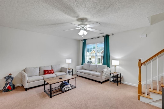 33 Middlebrook Dr, Cartersville, GA 30120 - carpeted living room with a ceiling fan, stairway, a textured ceiling, and baseboards