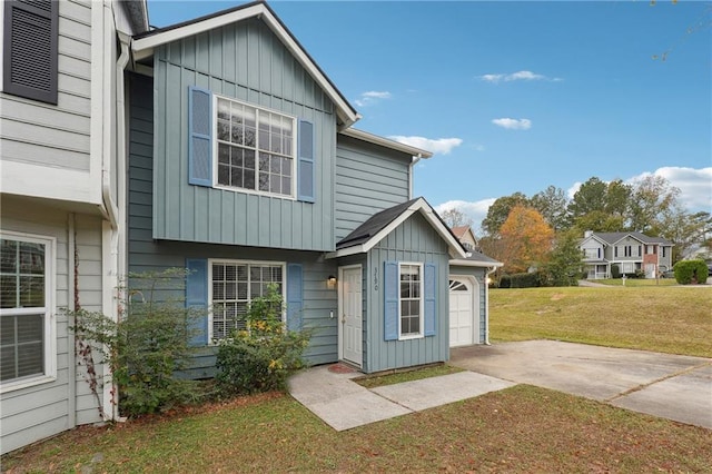 exterior space with a garage and a yard