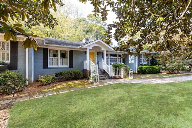 ranch-style house with a front lawn