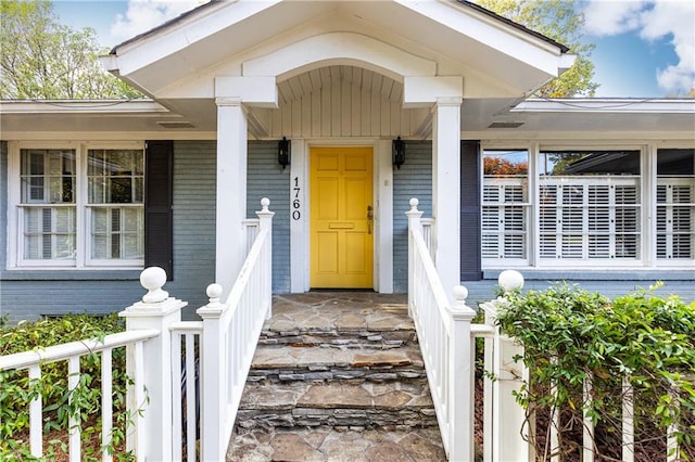 doorway to property with covered porch