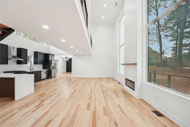 dining room with light hardwood / wood-style flooring and an inviting chandelier