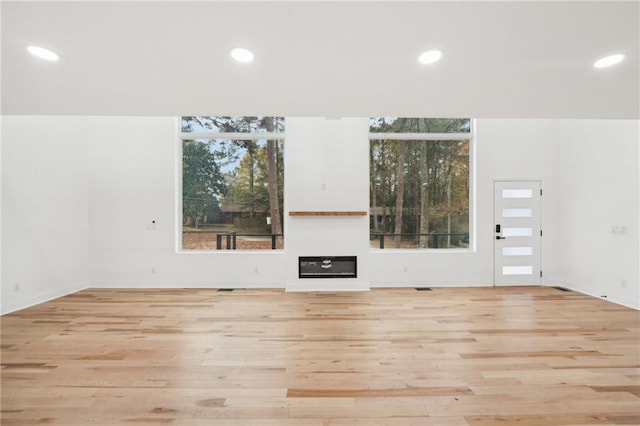 bedroom with access to outside, ceiling fan, and light hardwood / wood-style floors