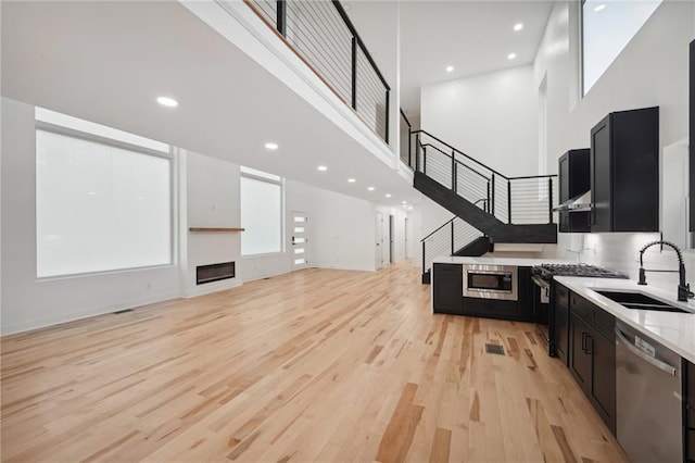 unfurnished living room featuring light hardwood / wood-style floors