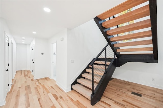 hall with light hardwood / wood-style flooring