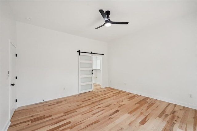 spacious closet with light hardwood / wood-style flooring