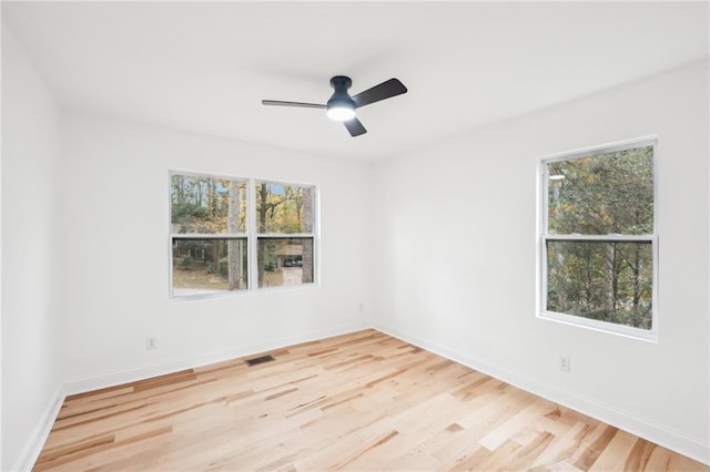 unfurnished bedroom with light hardwood / wood-style flooring, ceiling fan, and a closet