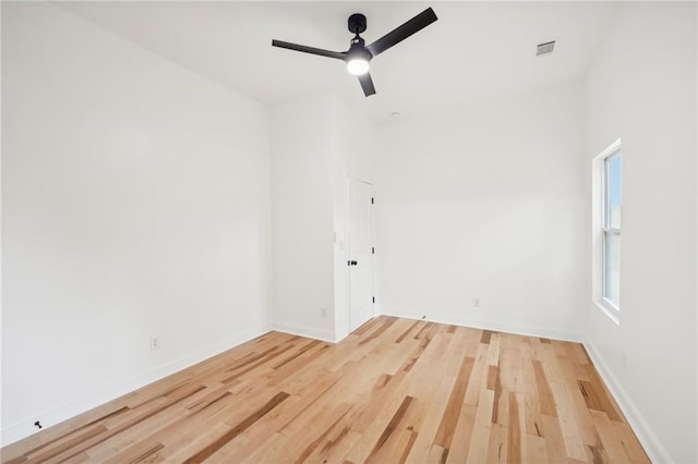 bathroom with a shower with door, vanity, and toilet