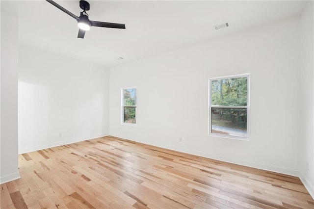 unfurnished room featuring light wood-type flooring and ceiling fan