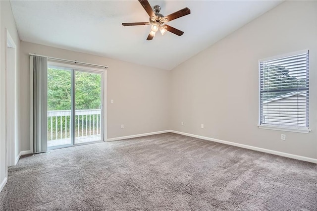 unfurnished room featuring ceiling fan, carpet flooring, and vaulted ceiling